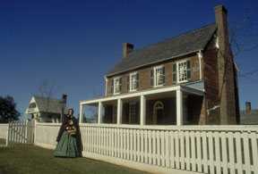 Woman in Civil War costome outside house in Appomattox